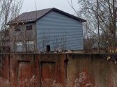 Обшивка сайдингом стороны здания